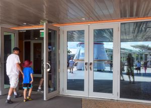Kai and Kenny enter the exhibit hall where the Space Shuttle Atlantis is displayed for all to see.